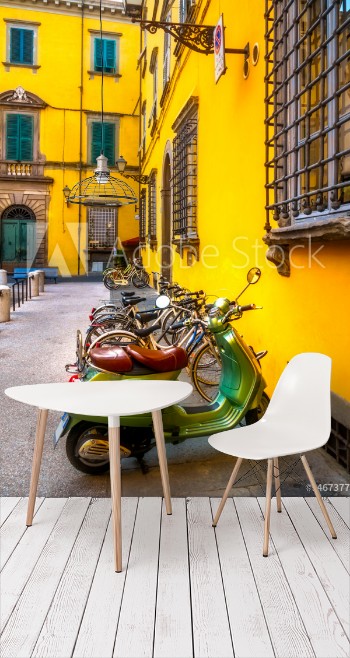 Bild på European motorbikes scooters vespas parked in Lucca Italy